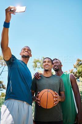 Buy stock photo Selfie, basketball and team with phone on court at game, training or practice. Fitness, sports and African athletes taking picture for social media on basketball court after game with mockup space.