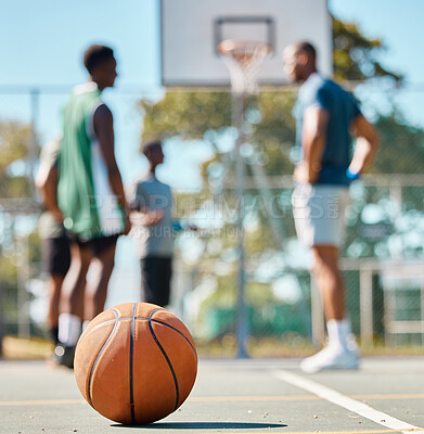 Buy stock photo Basketball, team sports and ball on the basketball court while group of players have a game planning discussion. Basketball players having a strategy meeting or teamwork collaboration for match plan