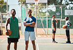 Sports, friends and basketball by basketball player team happy, smile and proud at basketball court. Fitness, men and athletic players portrait excited for training, game and practice match at court