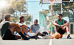 Basketball court, men and friends talking about game, sports and training motivation after exercise, workout or competition. Black man with street ball team at community playground planning strategy