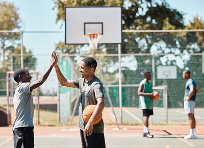 Buy stock photo Basketball court, high five and team sports, success and support, winners and achievement outdoor. Excited basketball player community, men and friends, celebration goals and competition motivation 