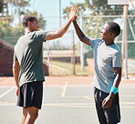 Fitness, high five and men on a basketball court for a game, practice or training together. Happy, celebration and male team with success after a match, tournament or competition on an outdoor court.