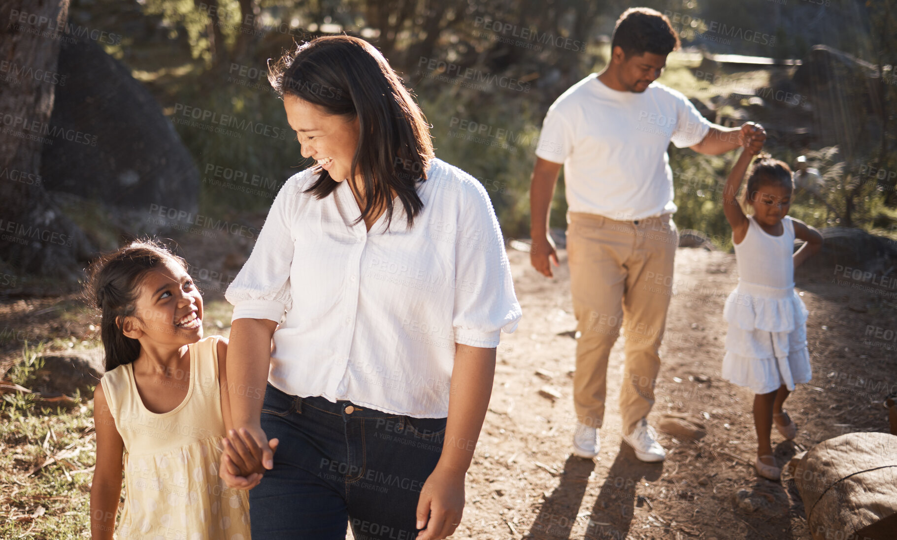 Buy stock photo Family, happy and walking in the park for bonding, fun and care in summer outside. Mother, father and parents playfully walk with girl children, kids and siblings in nature garden for summer bonding