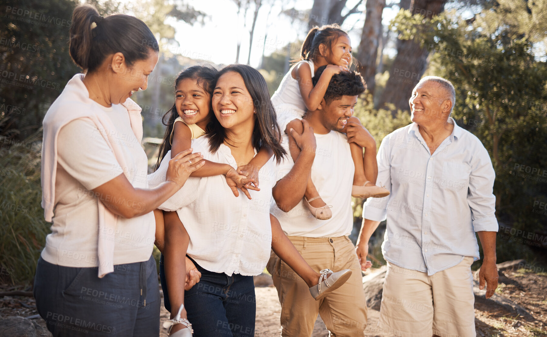 Buy stock photo Big family walking in park, summer and freedom together in outdoor fresh air . Happy family, parents and grandparents in garden with excited kids to relax, bond and enjoy quality time, love and fun 