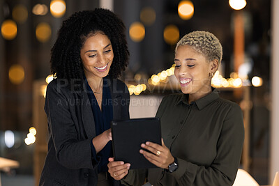 Buy stock photo Tablet, black woman and social media manager at a digital marketing agency coworking on a branding strategy. Night, teamwork and happy women reading a blog article on a copywriting social network