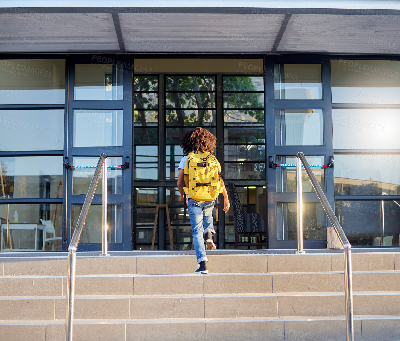 Buy stock photo Child, walking and school entrance for education, learning or childhood development at academy building. Kid having a walk up the steps ready for back to school morning with backpack for knowledge