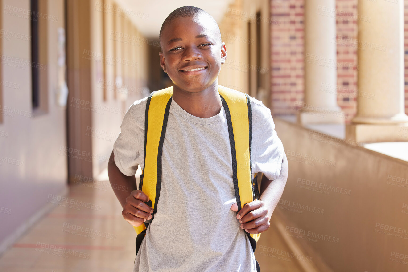 Buy stock photo Student, child and backpack standing in school campus lobby for study. Back to school portrait, African boy and ready for education, learning or knowledge with happy smile in high school building 