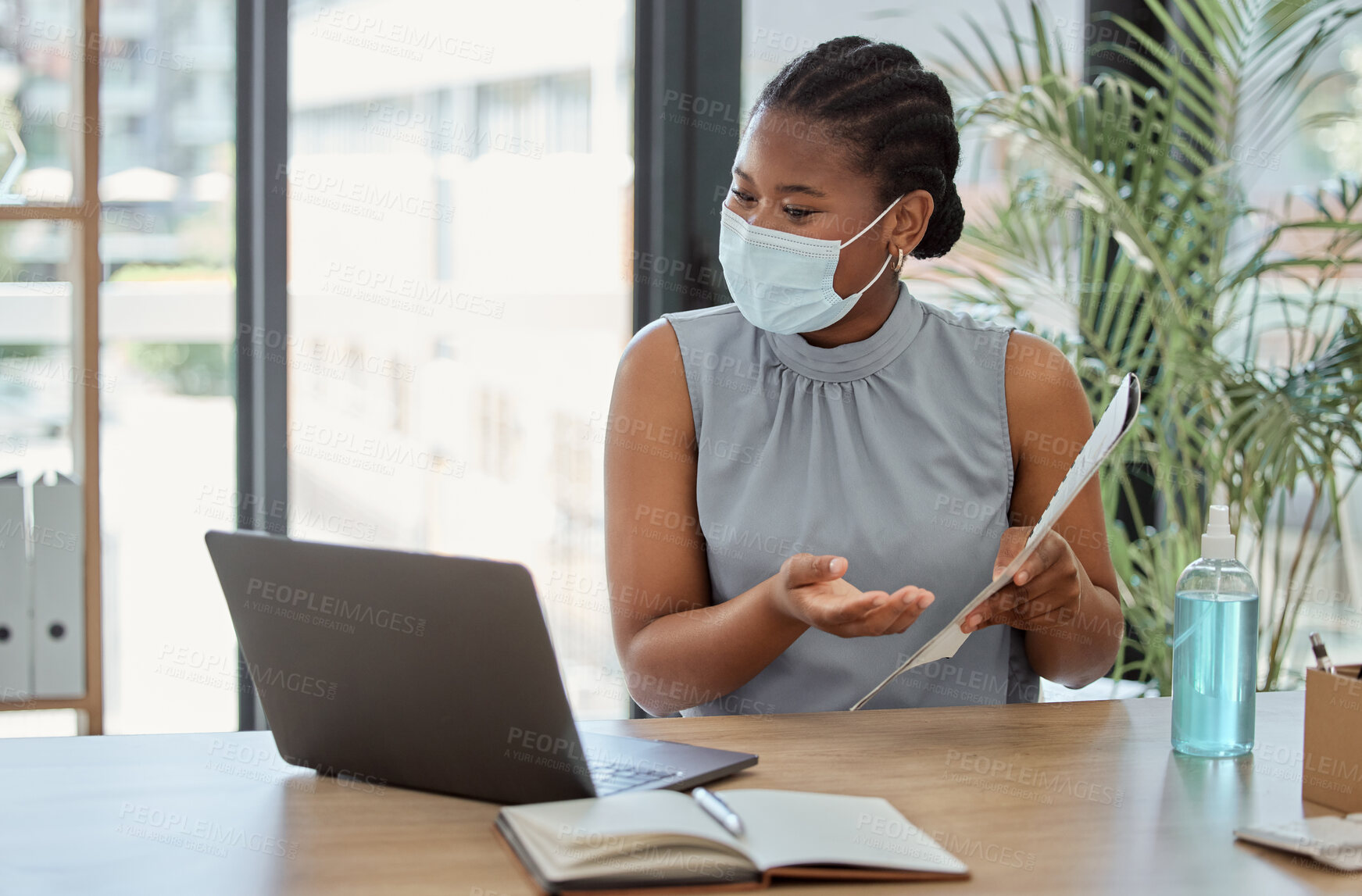 Buy stock photo Covid, laptop and black woman on a video call marketing a business proposal or startup paperwork feedback. Agenda, coronavirus and African employee in mask speaking, communication or talking online