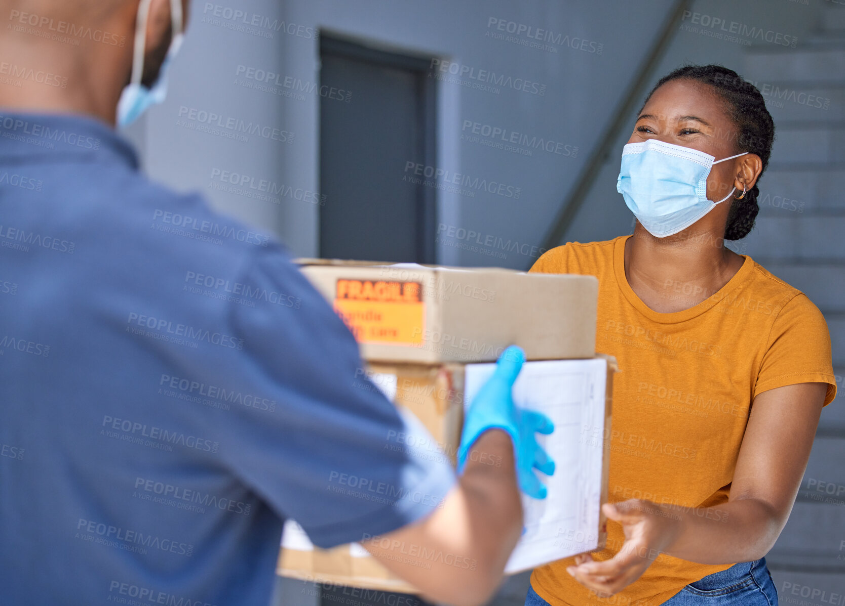 Buy stock photo Delivery box, shipping and happy customer with covid face mask for safety compliance at front door for logistics, supply chain and ecommerce product. Black woman with courier service man for package