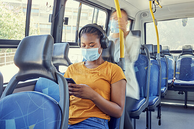 Buy stock photo Bus, travel and covid woman on a phone and headphones for corona virus update, listening to news and social media report on journey. Girl covid 19 face mask, technology and transport rules for safety