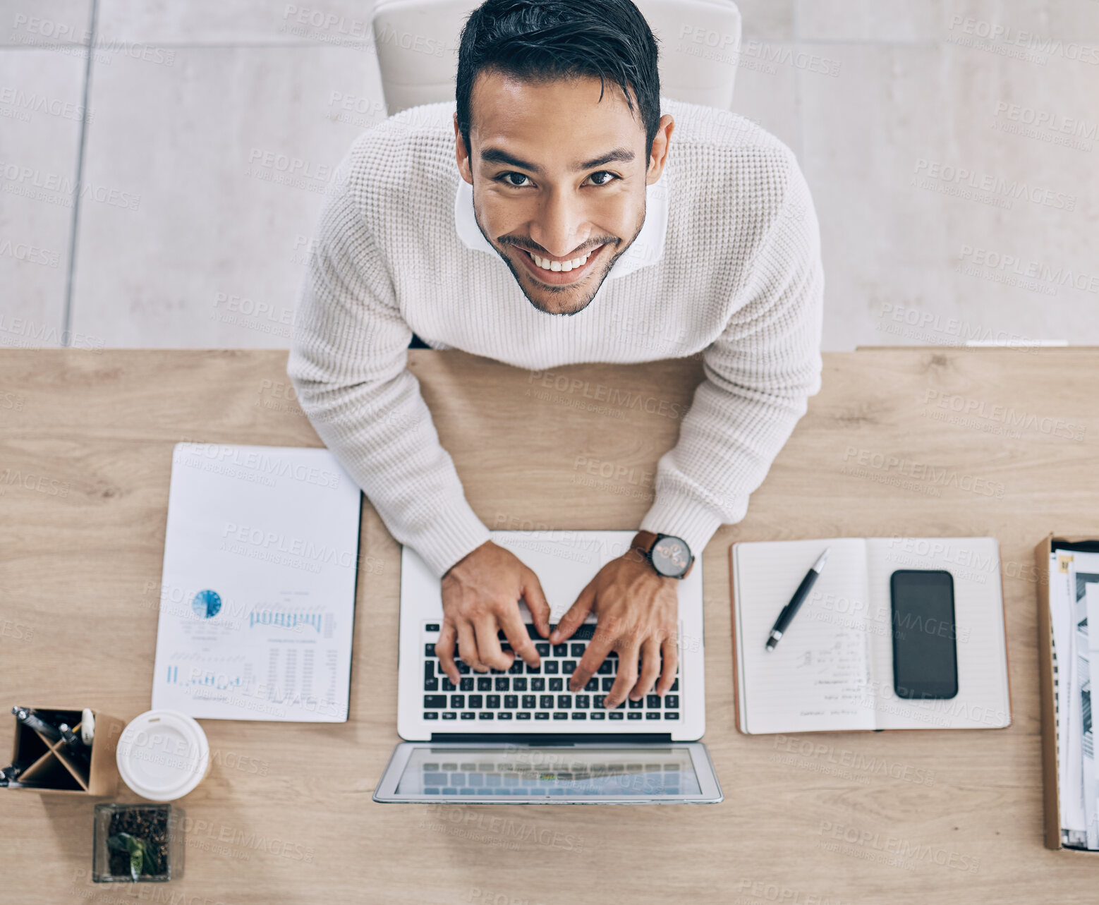 Buy stock photo Top view, working and businessman typing on laptop doing research online, business project and writing document. Overhead, work and portrait of male worker in office with computer, notebook and phone