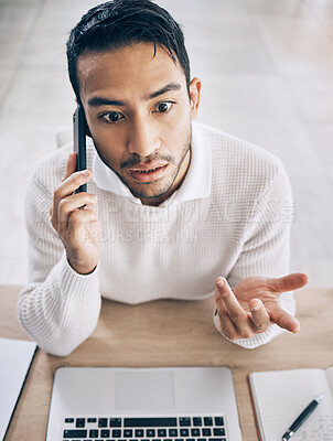 Buy stock photo Confused, business man and phone call with laptop, conversation and in office. Asian male, cellphone and talking for startup company, upset for deal and communication problem, smartphone and top view