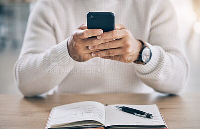 Buy stock photo Closeup, man typing and phone in office for communication, social media or email on web app. Hands, smartphone and chatting at workplace with book on desk for planning, research and digital marketing