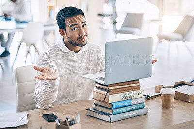 Buy stock photo Confused, laptop and multitask with a business man shrugging his shoulders while working in the office. Desk, question and doubt with a male employee multitasking while at work on a stack of books