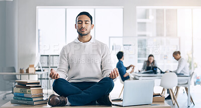 Buy stock photo Businessman, meditation and yoga on desk at startup, office or workplace for digital marketing. Happy worker man, relax and sitting on table for zen mindfulness in workplace at social media company