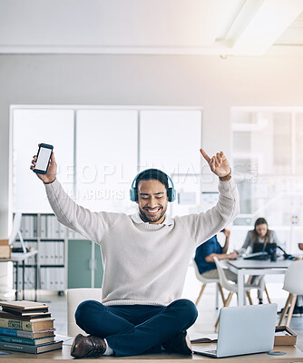 Buy stock photo Music, phone and businessman with headphones on desk listening to audio, track and radio in office. Freedom, happiness and man sitting on table in corporate workplace with mockup smartphone screen