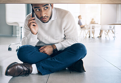 Buy stock photo Phone call, office and businessman sitting on floor under table with worry, fear and scared expression on face. Depression, anxiety and stressed male worker on smartphone call for help and support