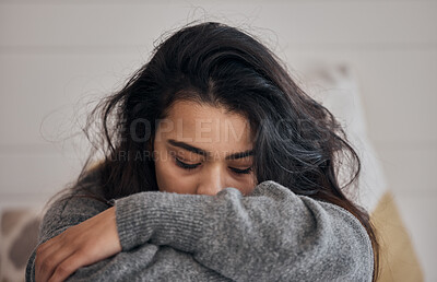 Woman, stress and depression in lonely mental health problems, issues or anxiety at home. Sad female face suffering from loneliness, withdrawal or abuse with depressed emotion alone in the bedroom
