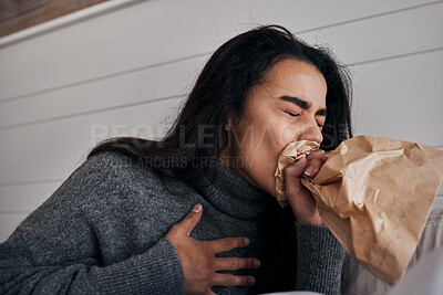 Buy stock photo Woman, anxiety and stress paper bag breathing of a woman with mental health problem or crisis. Hyperventilate, panic or fear of a female suffering from chest pain in a rehabilitation centre or home