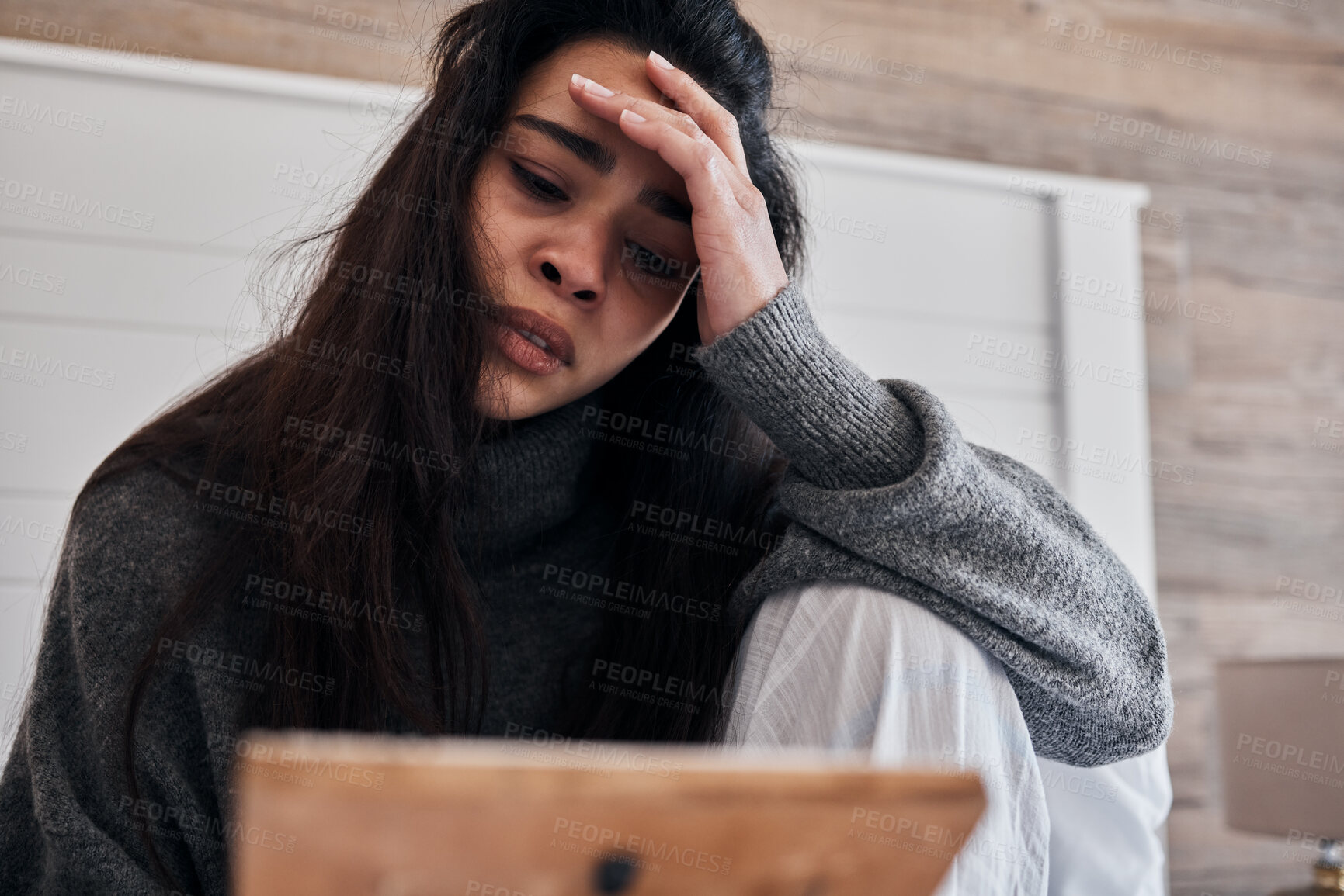 Buy stock photo Sad, depression and woman with frame in home looking at photo, feeling grief for death or loss. Mental health, anxiety or lonely female thinking of problems or frustrated after breakup alone in house