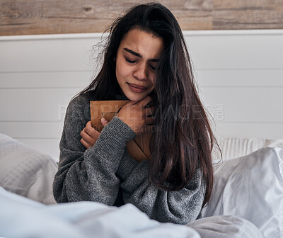 Buy stock photo Sad, loss and woman crying with a photo for memory while in bed in the morning. Depression, tears and girl with a picture frame in the bedroom during grief, sadness and sorrow about death in a house