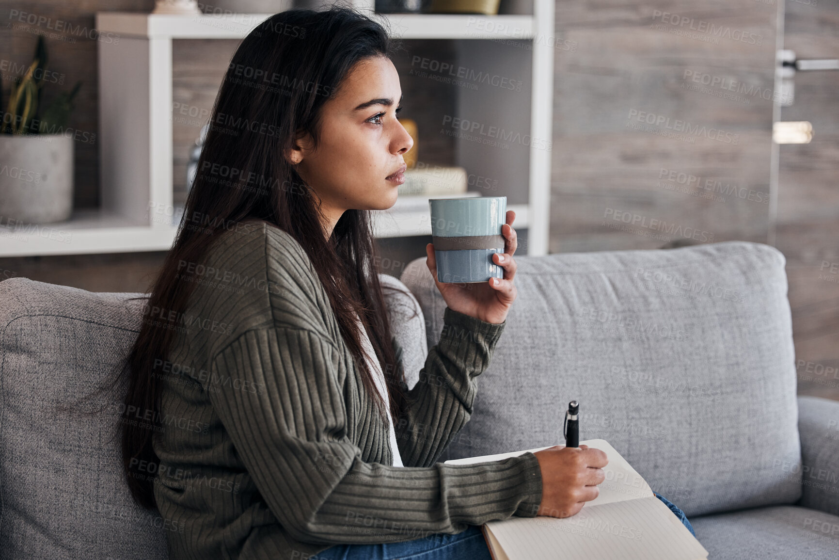 Buy stock photo Relax, thinking and woman journaling with coffee for self care on the living room sofa of her house. Idea, tea and girl with creativity in a notebook, green tea and writing in diary on the couch