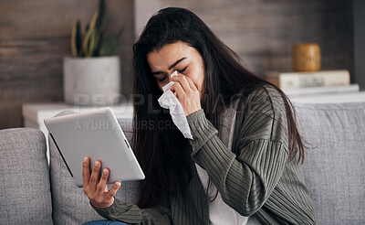 Buy stock photo Tablet, sad and crying with a woman on a video call or reading an ebook on the living room sofa or her home. Internet, reading and breakup with a female on the couch, wiping her tears after a cry