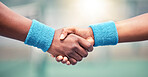 Handshake, sport with motivation and support, solidarity with congratulations or partnership, hands together closeup. Exercise, wrist band and fitness, active lifestyle with team shaking hands.