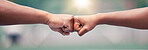 Closeup, fist bump and sport for success, motivation or teamwork together with lens flare while outdoor. Tennis player, friends and hands touch for support, team building or sports at summer training