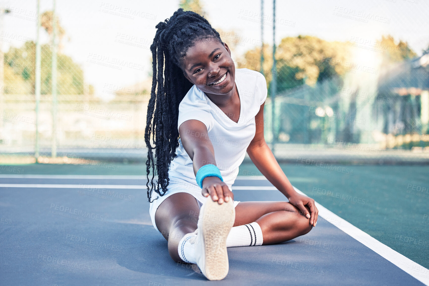 Buy stock photo Tennis, fitness and stretching woman on floor in sports court for health, wellness and competition training in happy portrait. African athlete ground warm up or exercise for muscle, energy and legs