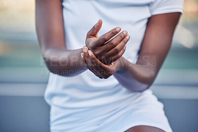 Buy stock photo Tennis, sport and hand injury, pain and black woman hurt during game, fitness and exercise with sports accident and emergency. Athlete sprain, inflammation and medical care with training and active.