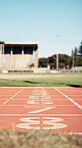 Empty stadium, sports and race track with numbers for start position in athletics, marathon or competition. Ground, arena and event field for running, sprint or cardio exercise, workout or training.
