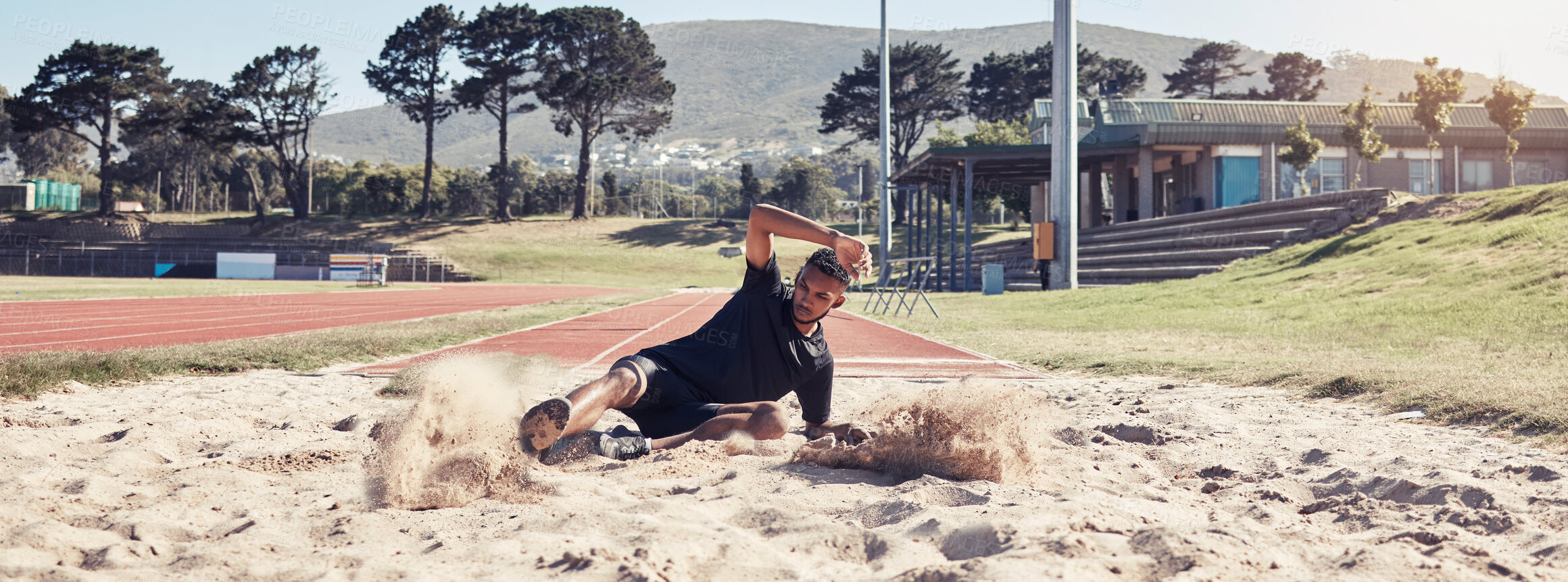 Buy stock photo Athlete long jump, sand and sports man training for France olympic competition, workout challenge or fitness exercise. Winner mindset, commitment and athletics person working on leg power performance