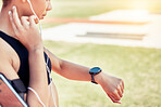 Smartwatch, pulse and woman runner training for a race, competition or marathon on a field. Fitness, sports and healthy girl athlete checking her health while doing outdoor cardio workout or exercise