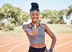 Runner, woman and thumbs up in portrait on track, field and outdoor for training, exercise and smile. Happy athlete, black woman and hand sign with happiness, workout or running in sunshine for sport