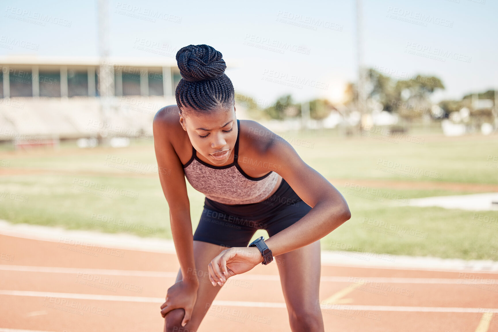 Buy stock photo Black woman, fitness and runner checking watch for monitoring exercise, workout or sports track time. Active African American female looking at smart watch in running sport for performance tracking