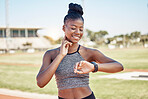 Fitness, smartwatch and heart rate with black woman running on stadium track for training, sprinting or stamina endurance. Goals, tracker and progress app with runner checking time for cardio workout