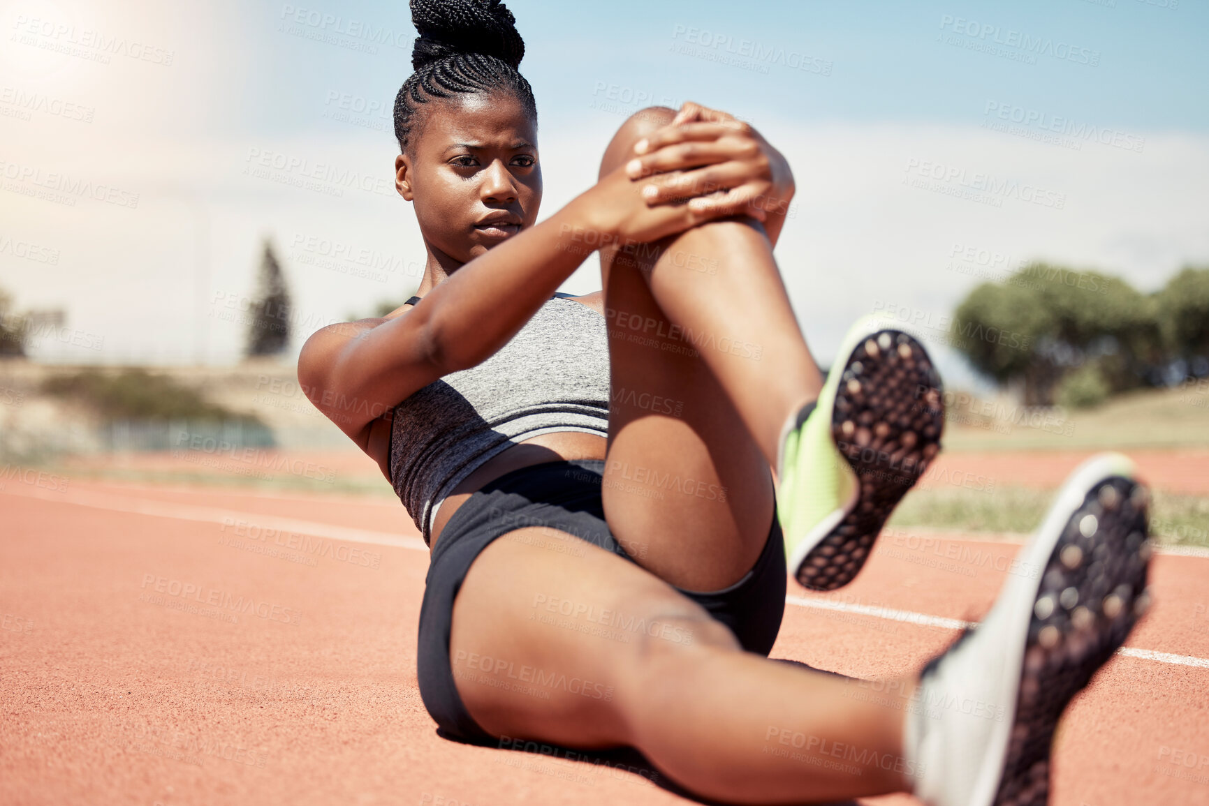 Buy stock photo Black woman, runner stretching and training for race on racing track in stadium with focus, determination and motivation. Outdoor fitness workout, running sports exercise and athlete stretch on floor