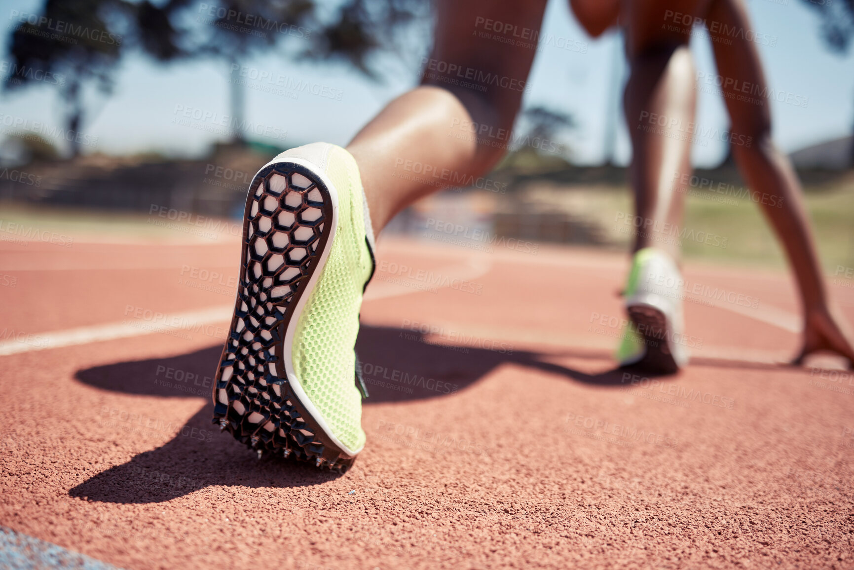 Buy stock photo Runner, start race and closeup feet, legs or ready for competition, contest or sport event in sunshine. Athlete, training and running in position for fast speed on ground for success in summer run