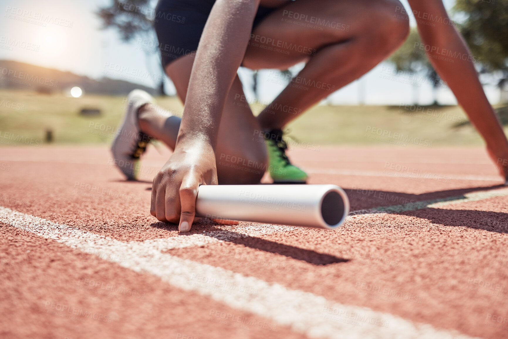 Buy stock photo Stadium, running sports and relay athlete on start track ready for race. Fitness, athletics and black woman with baton preparing for sprint, exercise and workout training for competition outdoors.