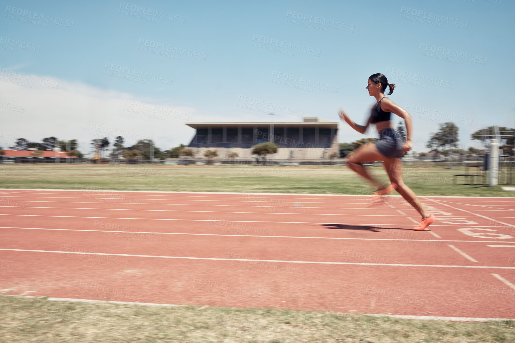 Buy stock photo Woman, fast runner and sports on stadium track for marathon training or exercise wellness. Athlete person, motion blur and running workout or fitness cardio, energy and speed or race performance 