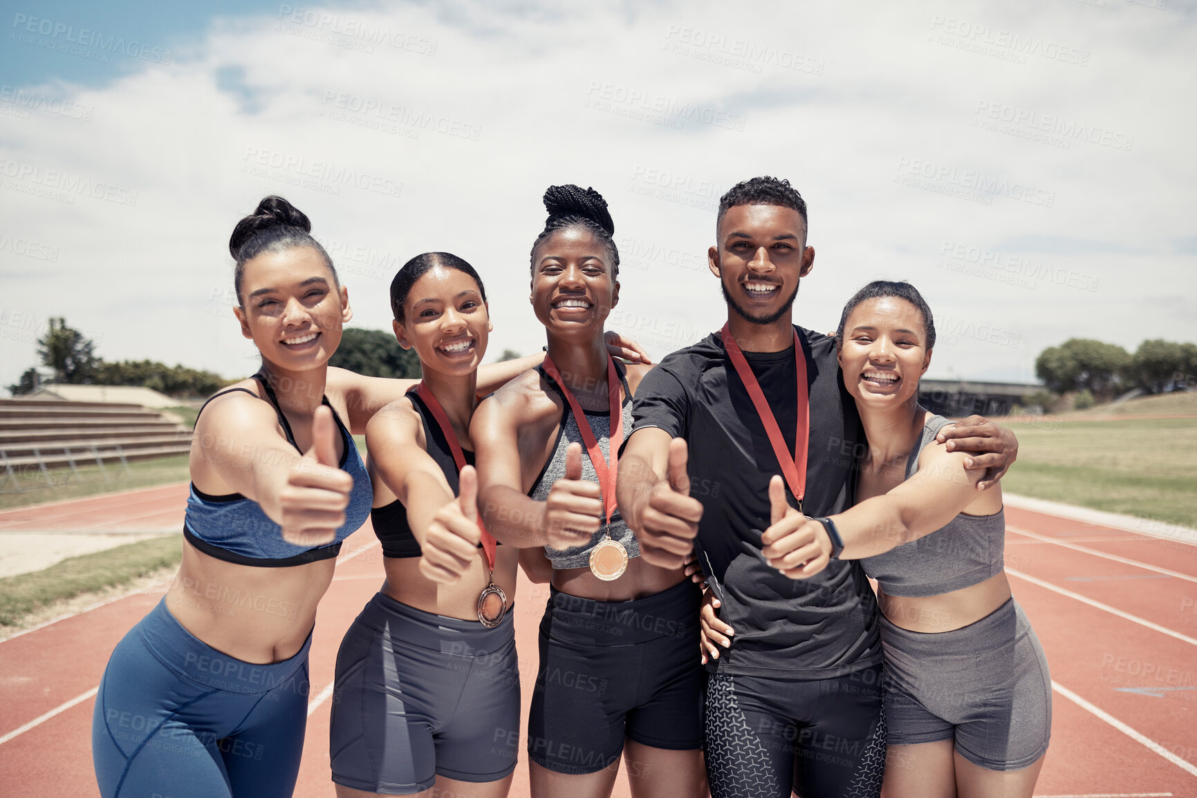 Buy stock photo Team, thumbs up and sport winner with medal, runner and happy in portrait, success and win on race track. Young black man, diversity and fitness, athlete winning with exercise and collaboration.