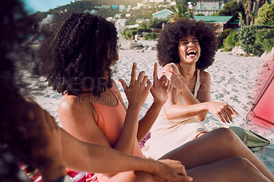 Buy stock photo Travel, beach and funny friends on a holiday vacation in summer laughing at a crazy joke together with freedom. Smile, relax and happy young African women enjoy quality time on a sand picnic at sea