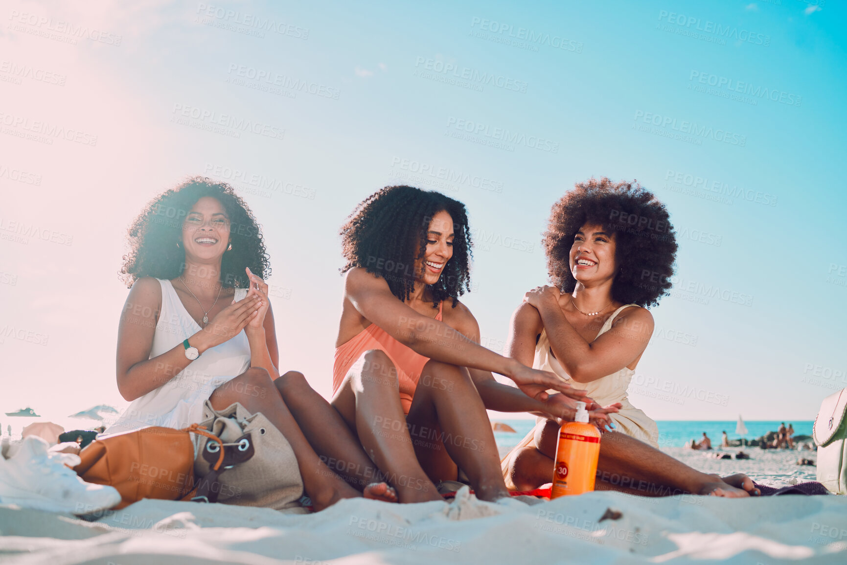 Buy stock photo Friends, sunscreen and relax at beach, happy and summer holiday, travel and blue sky in Miami, happy and smile. Blaxk women, vacation and ocean vacation, happiness and afro with skincare and safety 