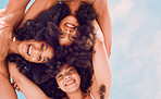 Beauty, community and afro friends in a circle, relax, smile and blue sky while having fun together. Freedom, face and happy women embracing in a trust huddle, excited at a social gathering outdoor
