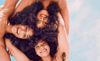 Buy stock photo Beauty, community and afro friends in a circle, relax, smile and blue sky while having fun together. Freedom, face and happy women embracing in a trust huddle, excited at a social gathering outdoor