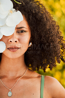 Buy stock photo Black woman, beauty and orchid flower outdoor in nature for cosmetic, makeup and natural dermatology product. Face of aesthetic model with natural plant skincare, health and fashion vacation portrait