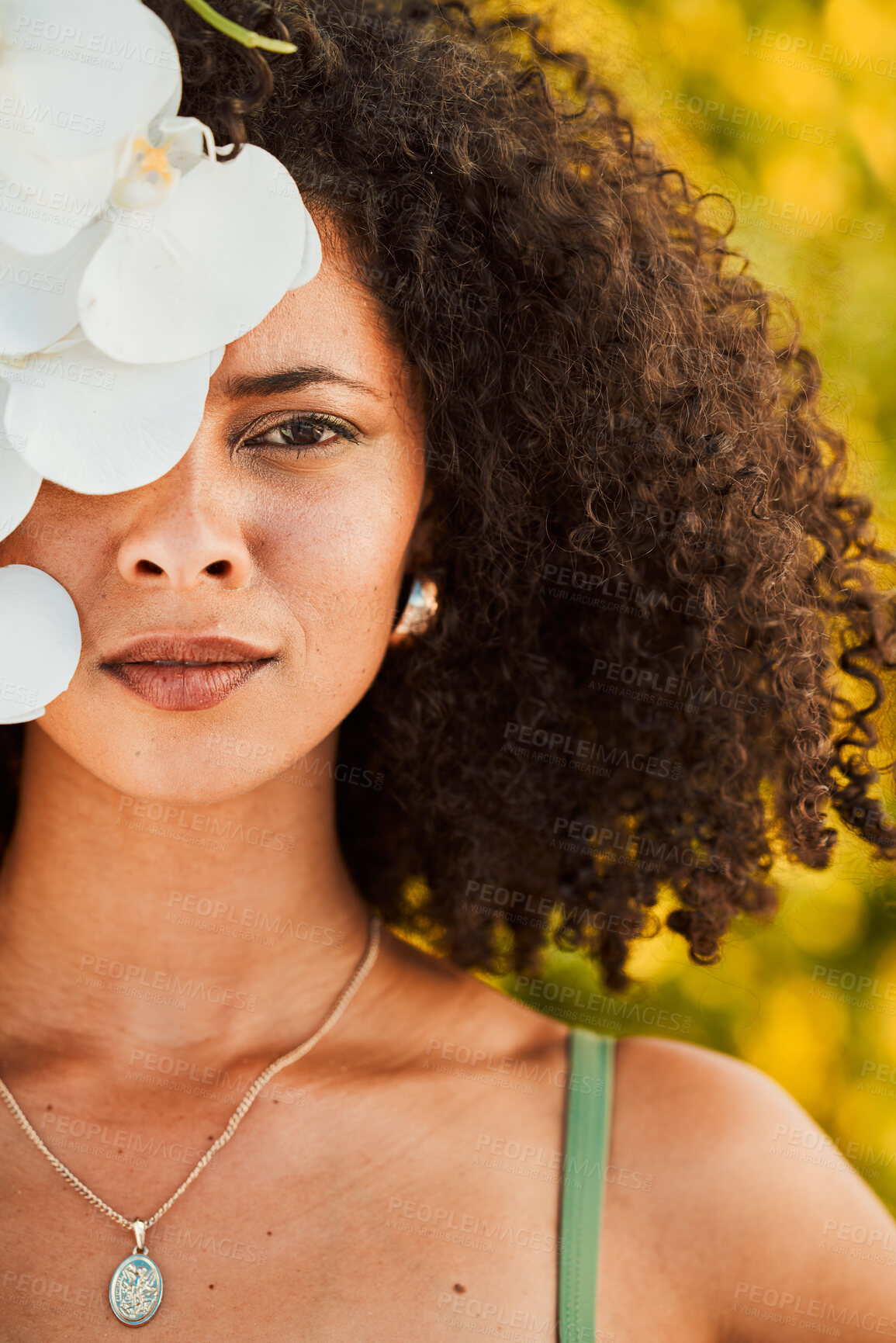 Buy stock photo Black woman, beauty and orchid flower outdoor in nature for cosmetic, makeup and natural dermatology product. Face of aesthetic model with natural plant skincare, health and fashion vacation portrait