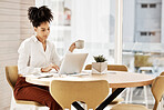 Black woman, laptop and typing for business, focus and at desk in office for strategy planning. Female entrepreneur, African American girl and owner browse internet, online reading and in workplace. 