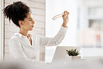 Business, black woman and glasses for reading on laptop in a clean office with vision, focus and eye care. Female entrepreneur at desk with fashion eyeglasses while thinking of innovation strategy